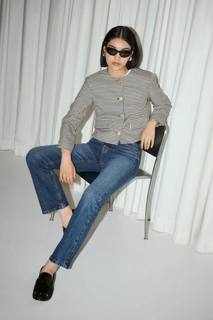 Front full body view of a white women's cropped blazer
