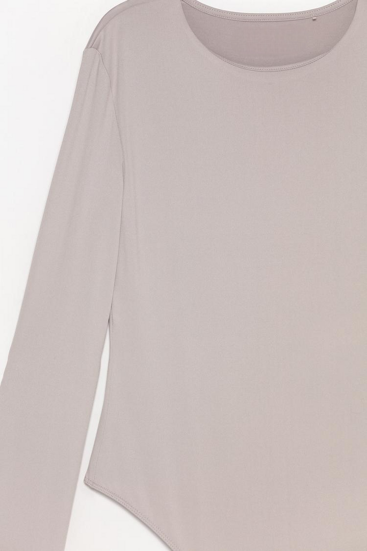 Full product view of the grey polyamide round neck bodysuit, highlighting its smooth, stretchy fabric and classic round neckline for a flattering, comfortable fit. Perfect for layering or wearing on its own.