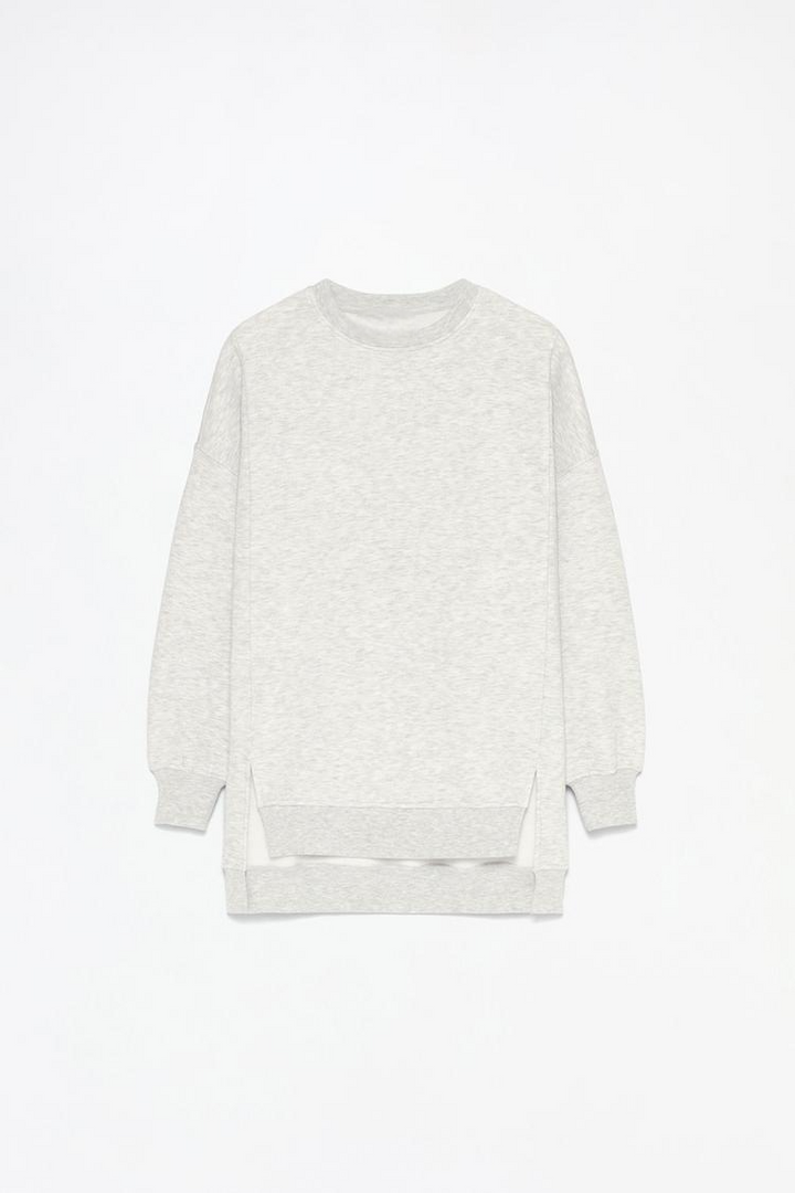 Women's grey oversized sweatshirt with an asymmetric design, offering a stylish and comfortable fit for casual wear.