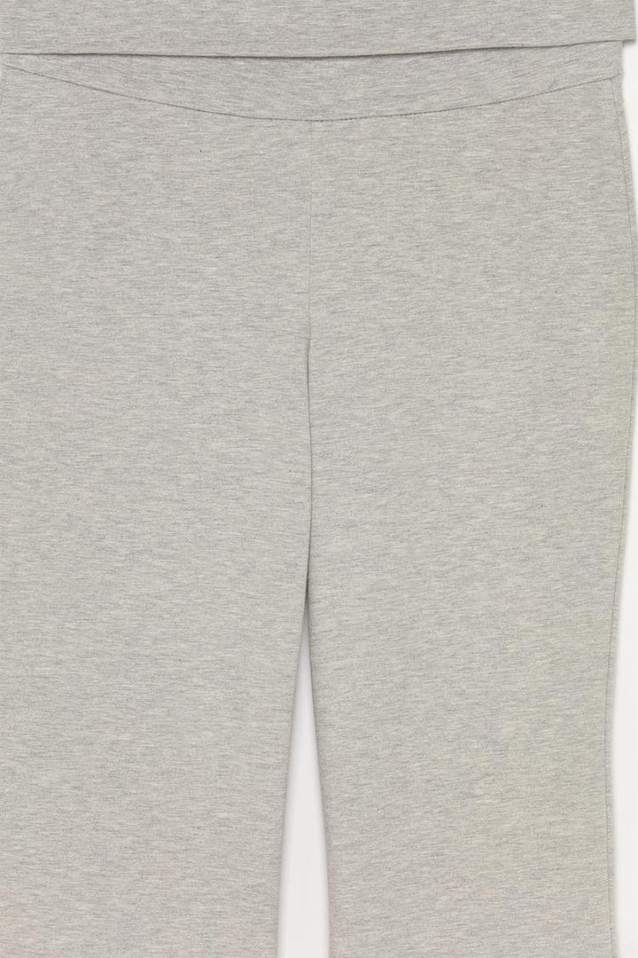 Product shot showcasing the grey color and the fold-over waist, ideal for both fashion and function.