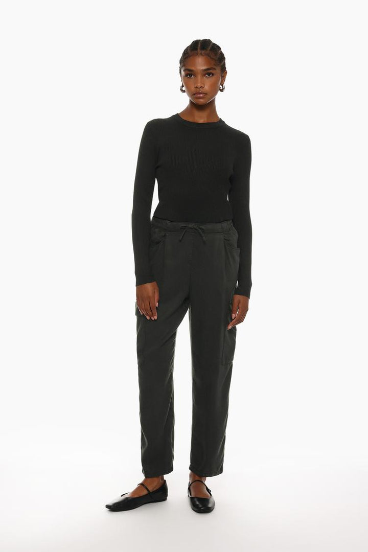 Stylish black flowing cargo joggers with a relaxed fit, perfect for casual and semi-casual outfits.