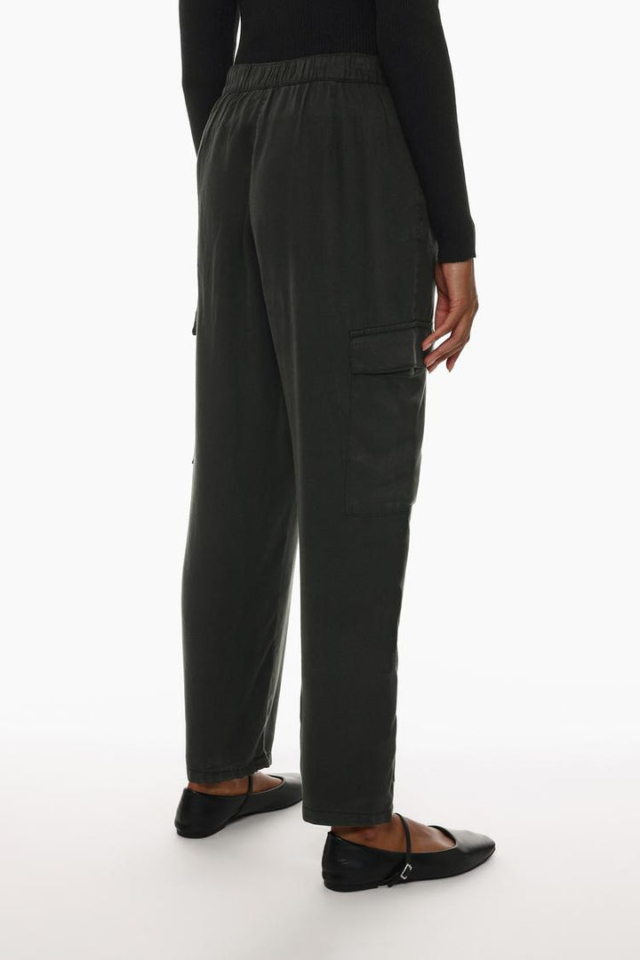 Rear view of the black flowing cargo joggers, emphasizing their comfortable fit and utility-inspired details.