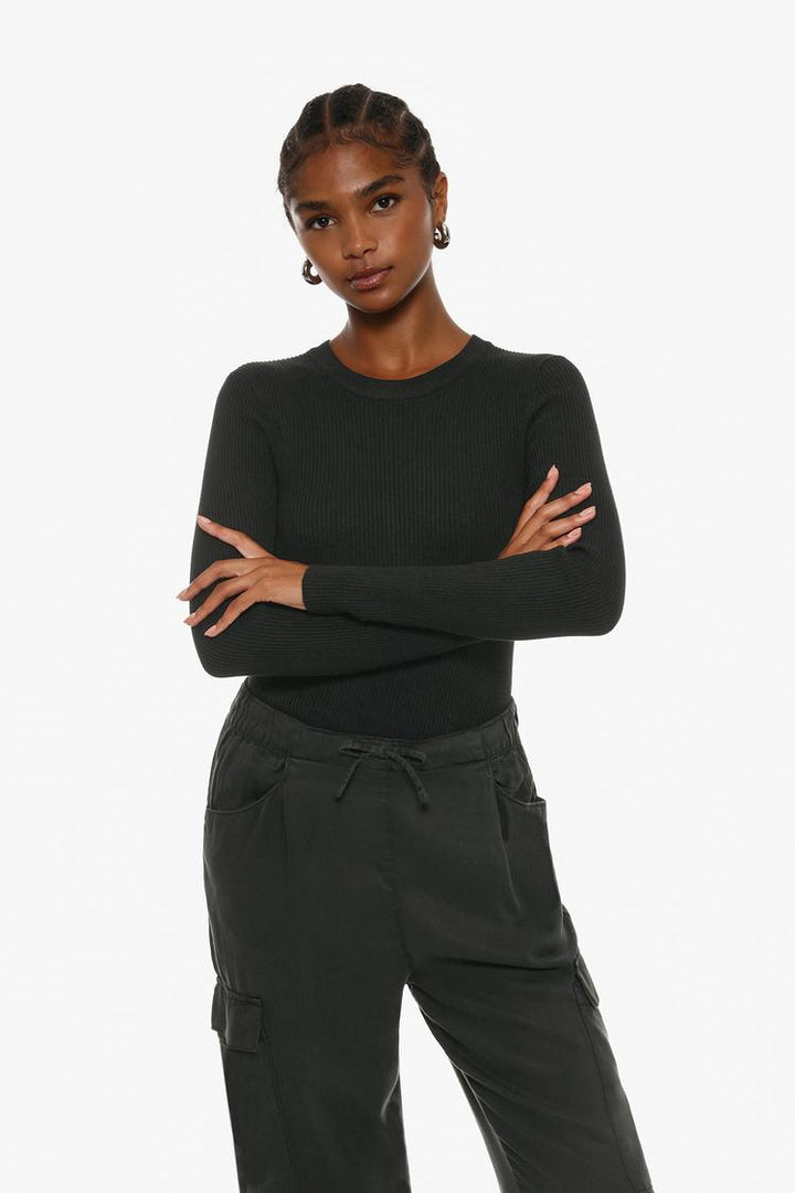 Styled look featuring the black flowing cargo joggers, ideal for urban and laid-back aesthetics.
