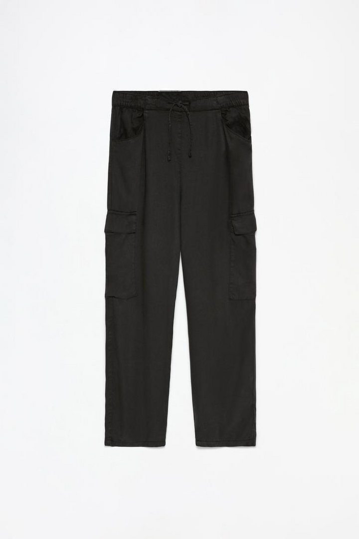 Complete product view of the black flowing cargo joggers, showcasing the pockets and sleek design.