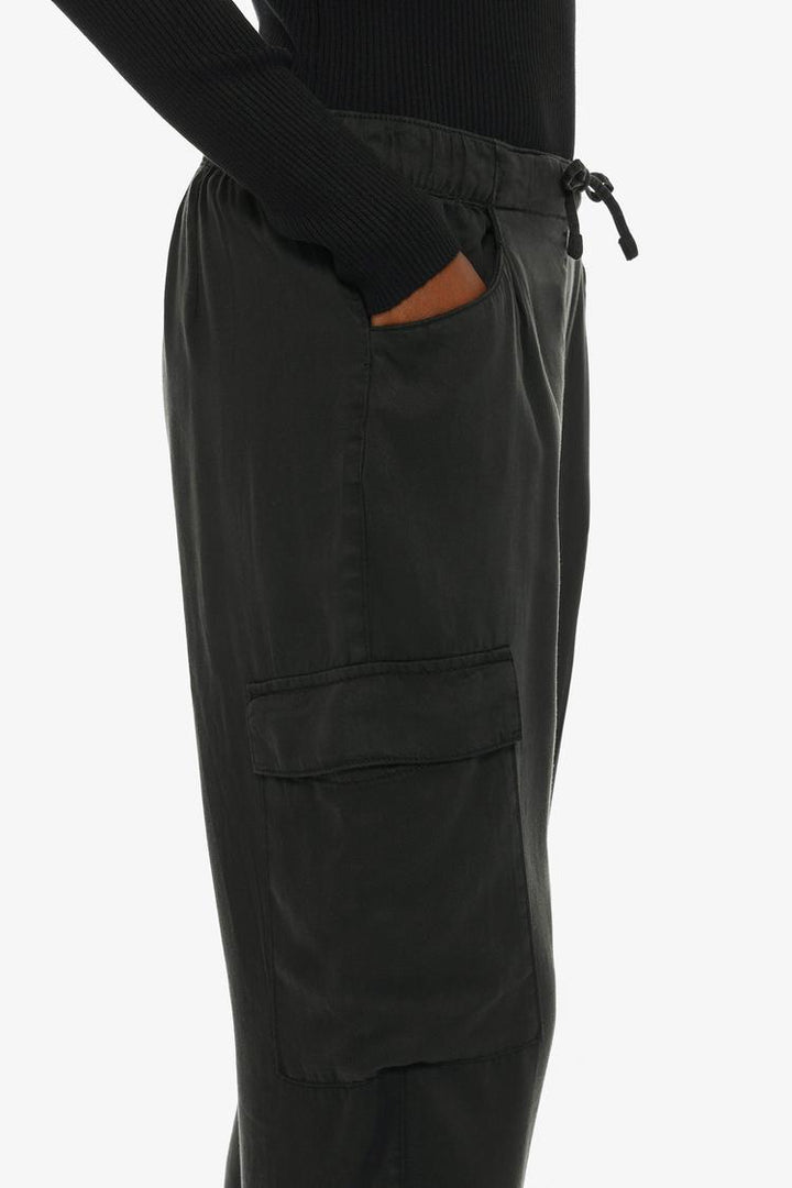 Side view of the black flowing cargo joggers, showcasing their flowing silhouette and modern design.