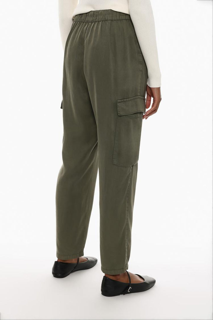 Rear view of the green flowing cargo joggers, emphasizing their tailored fit and modern design.