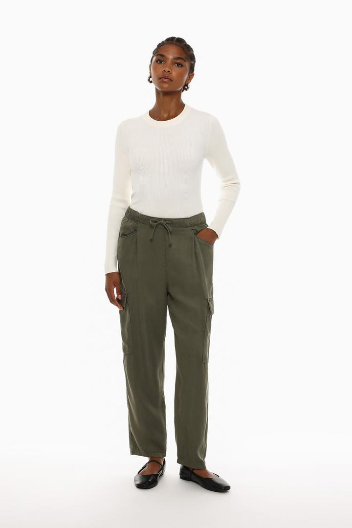 Outfit inspiration featuring the green flowing cargo joggers, showcasing their versatile nature.