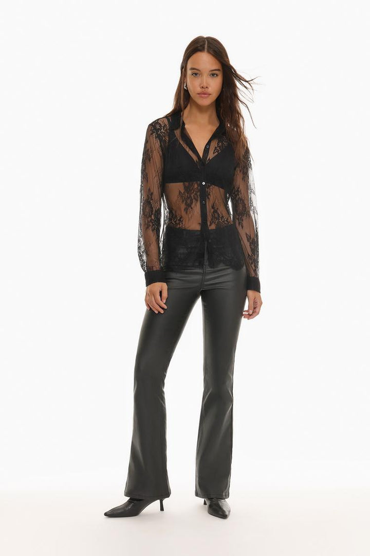 Full body view of a lace shirt, highlighting its elegant design, sheer fabric, and flattering fit, perfect for a stylish and feminine look.