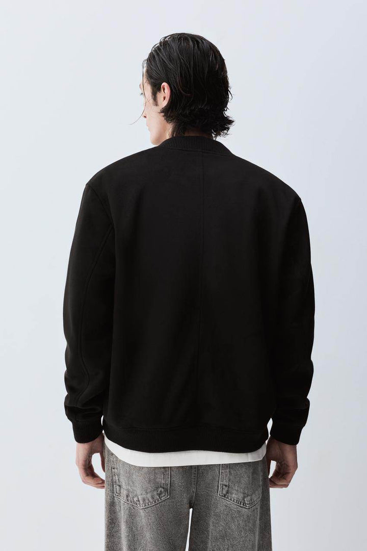 Back view of the men's black faux suede bomber

