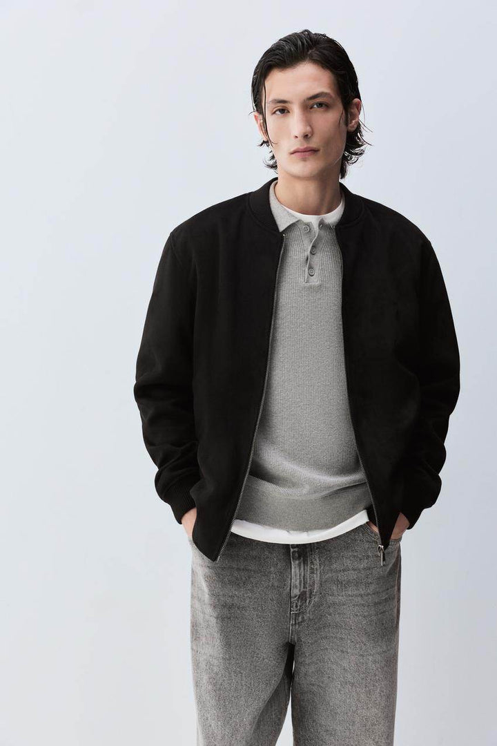 Front view of men's black faux suede bomber jacket

