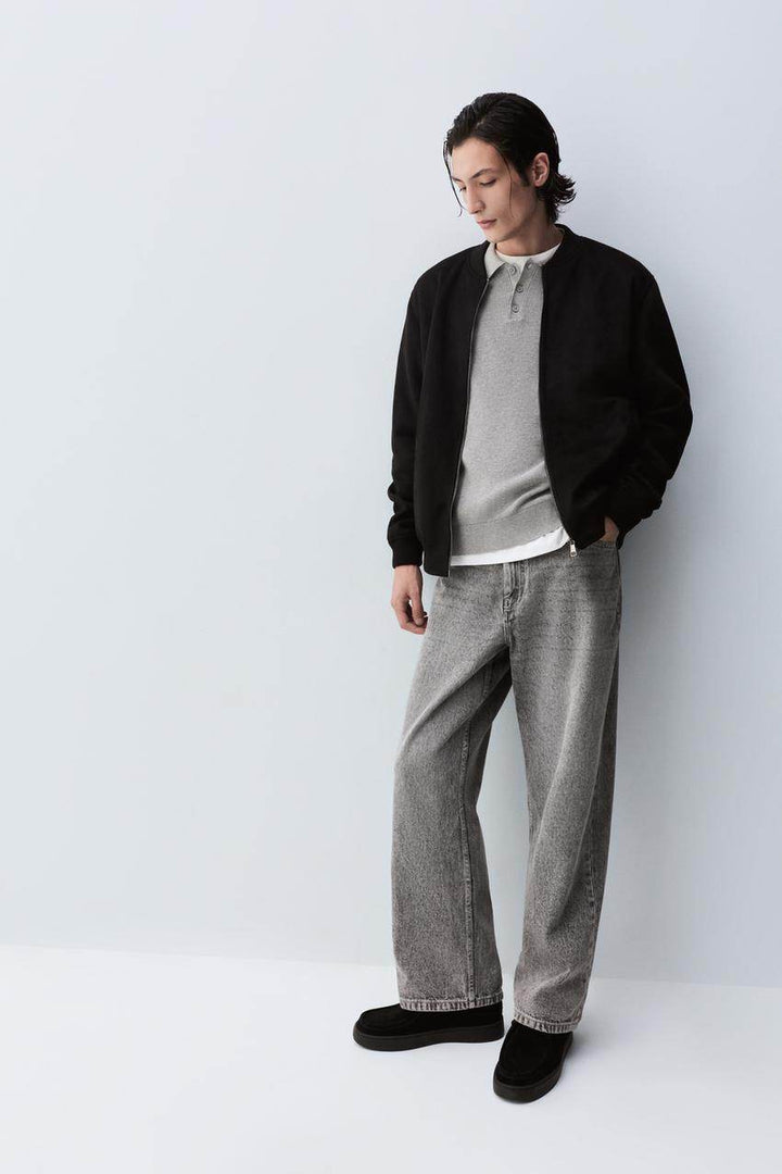 Side view of the men's black faux suede bomber

