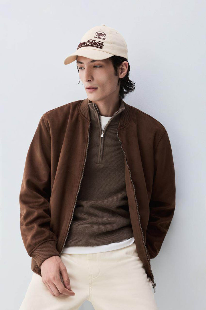 Model showcasing brown faux suede bomber front

