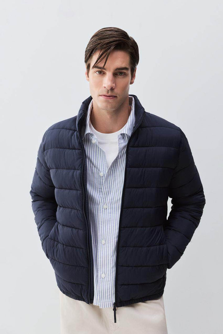 Front view of men's navy lightweight puffer jacket

