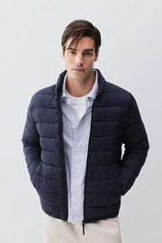 Front view of men's navy lightweight puffer jacket

