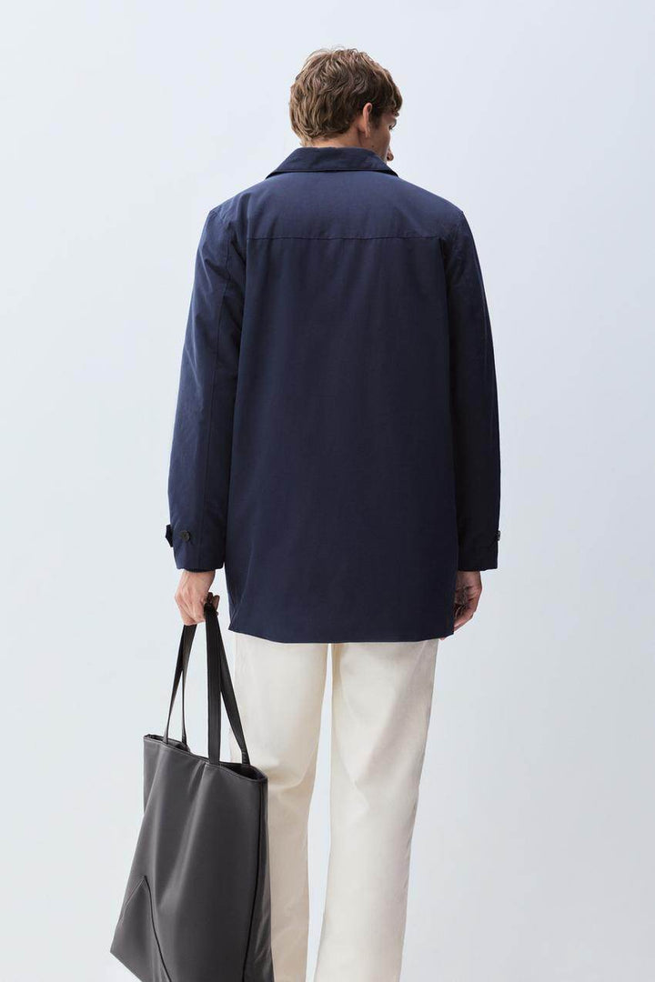 Back view of the men's navy padded trench coat

