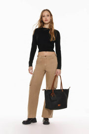 Stylish beige oversize cargo trousers featuring utility-inspired buckles and a relaxed, contemporary fit.