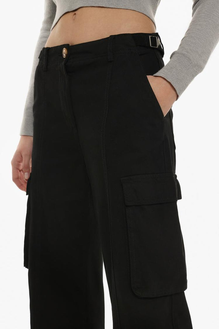 Styled outfit featuring the black cargo trousers, perfect for a laid-back or urban-chic aesthetic.
