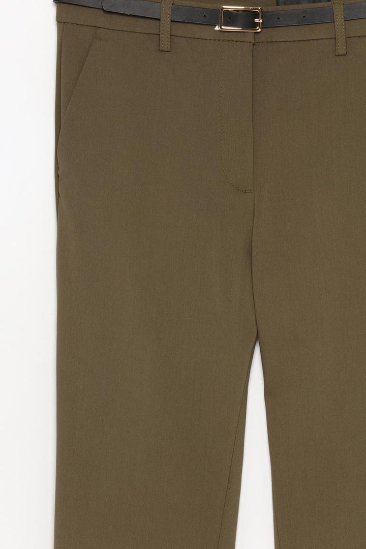 Detailed product display of brown slim fit trousers with a belt, crafted for lasting durability