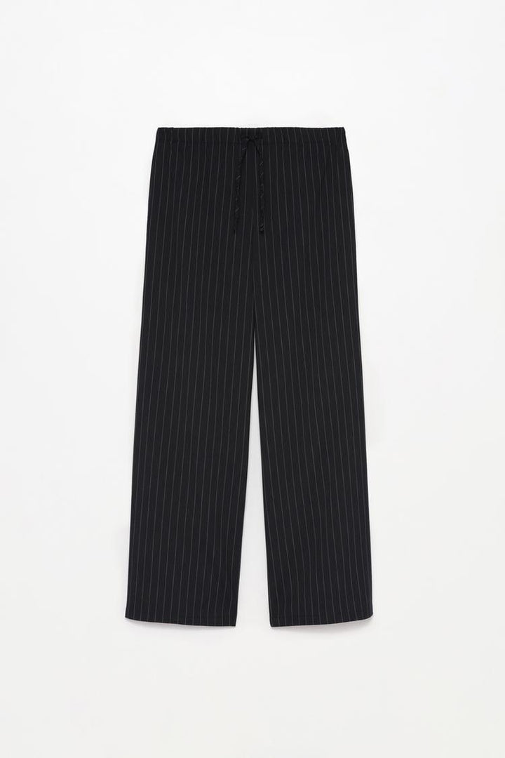 Full product view of black smart trousers with a waistband, offering versatility and style