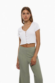 Elegant textured culottes in green, featuring a modern design with a sophisticated textured finish.