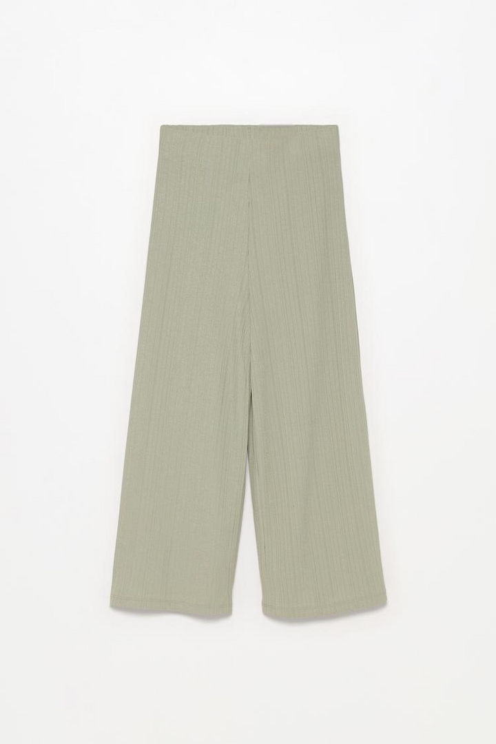 Complete product view of the green textured culottes, focusing on fabric detail and silhouette.