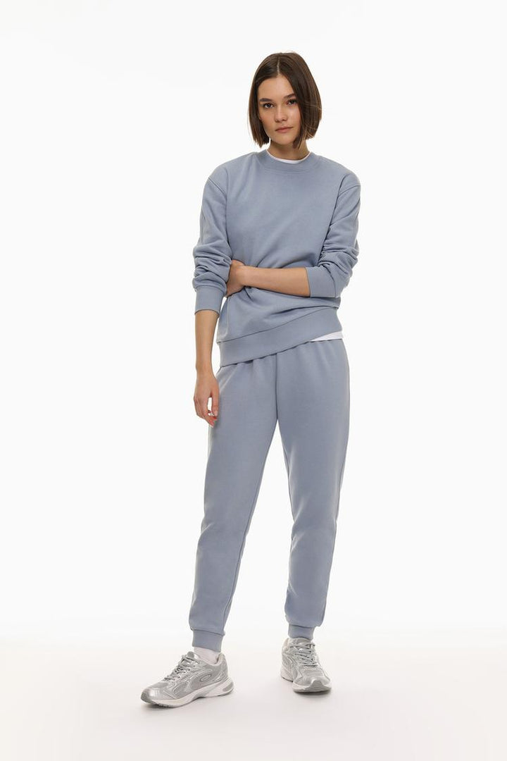 Blue tracksuit bottoms designed for comfort with a relaxed fit.