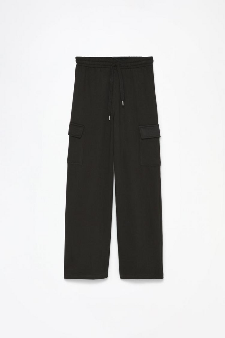 Full product shot of the black wide-leg cargo trousers, displaying all design elements, including pockets, buttons, and fabric details.