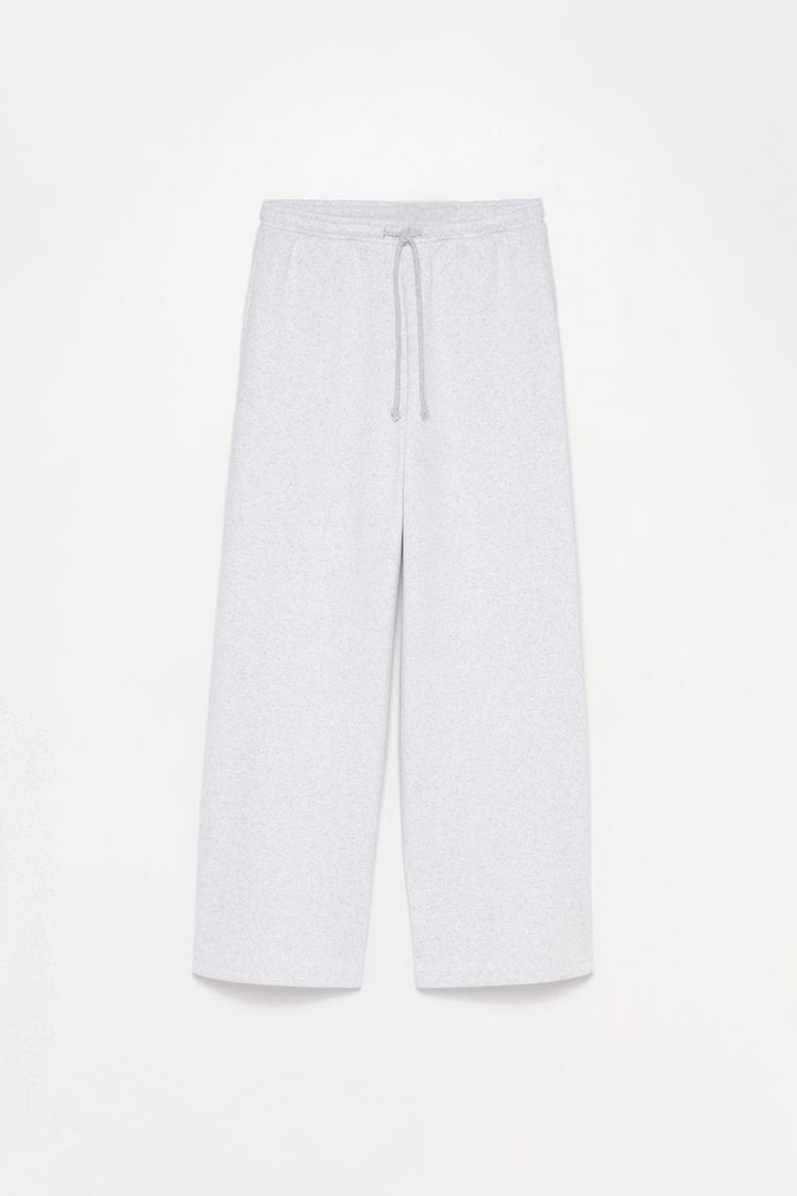 White wide-leg plush trousers designed for comfort with a relaxed fit.