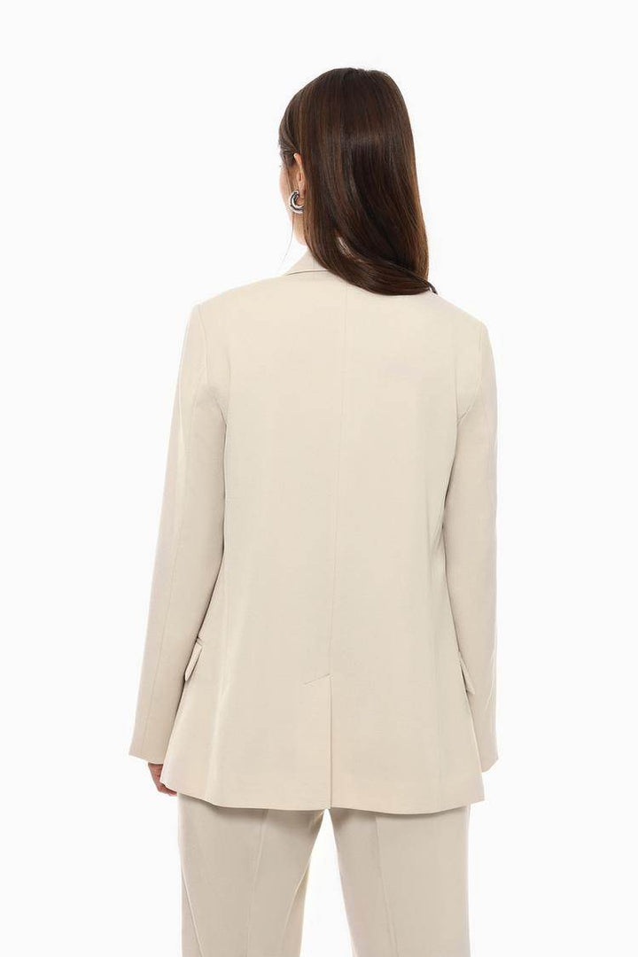 Back view of the women's beige basic blazer

