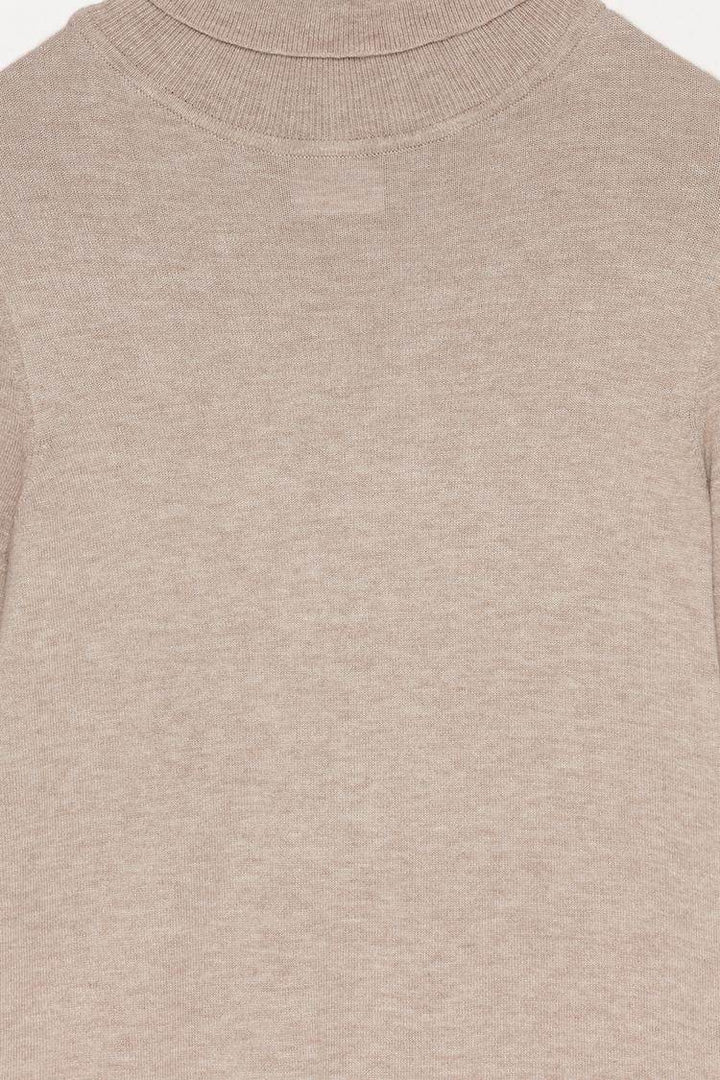 Close-up product image of beige turtleneck sweater

