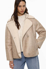 Full body front view of woman wearing beige brown double-faced coat

