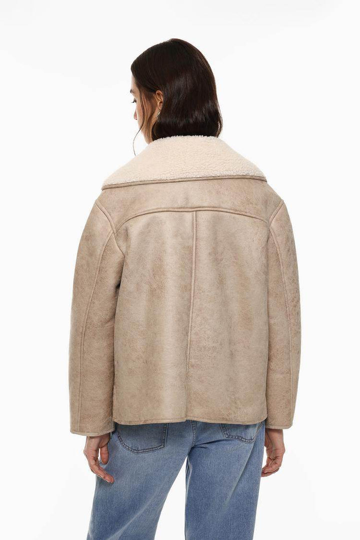 Model showcasing beige brown double-faced coat

