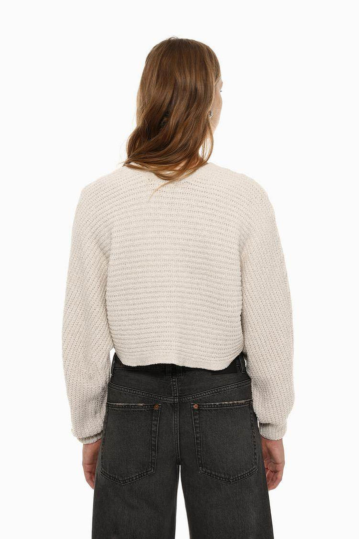 Back view of the women's beige cropped chenille sweater

