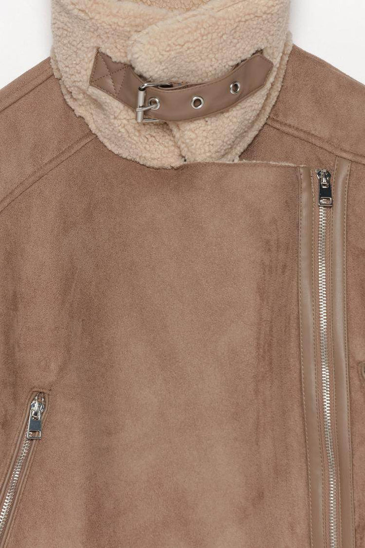 Close-up product image of beige crossover jacket

