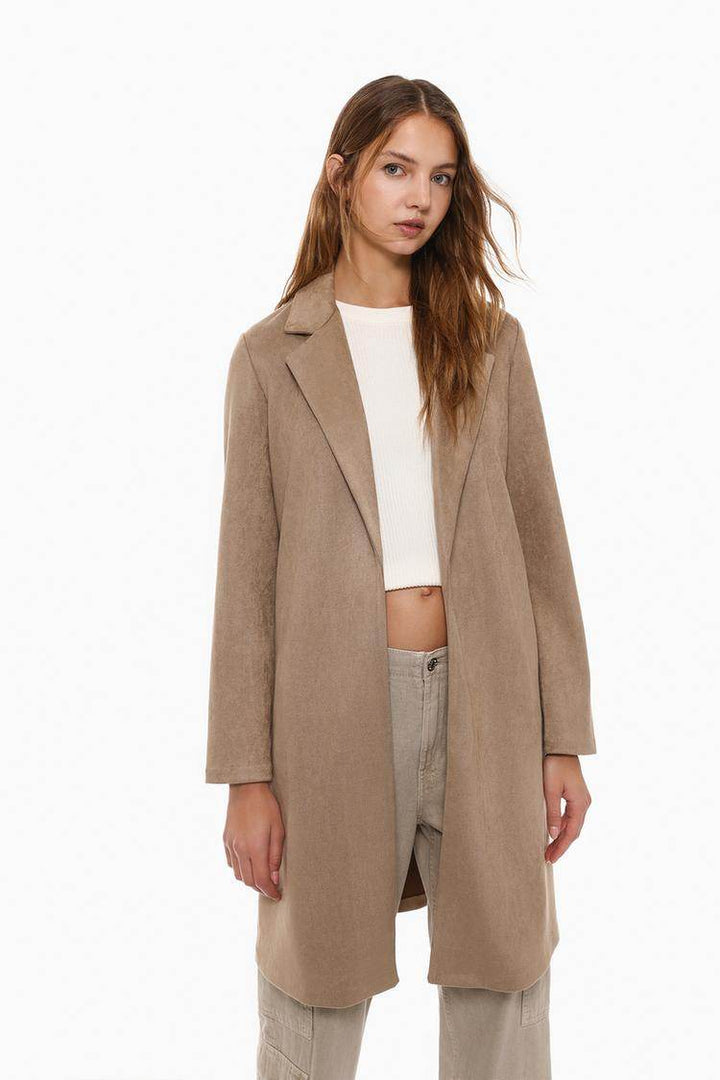Front view of women's beige faux suede coat


