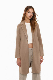 Front view of women's beige faux suede coat


