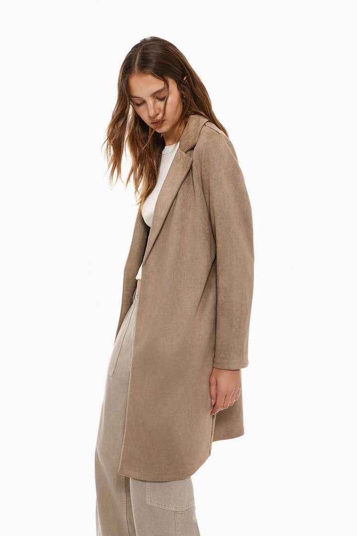 Side view of the women's beige faux suede coat

