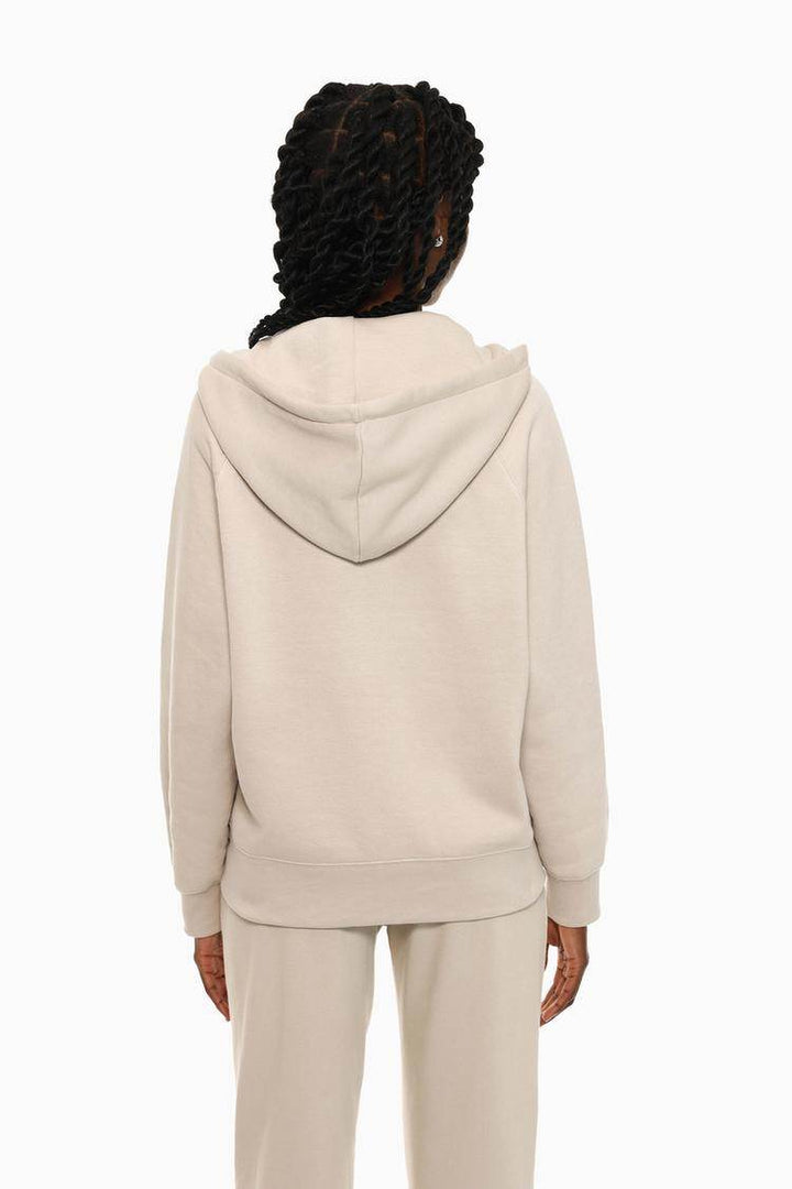 Back view of the women's beige hooded jacket

