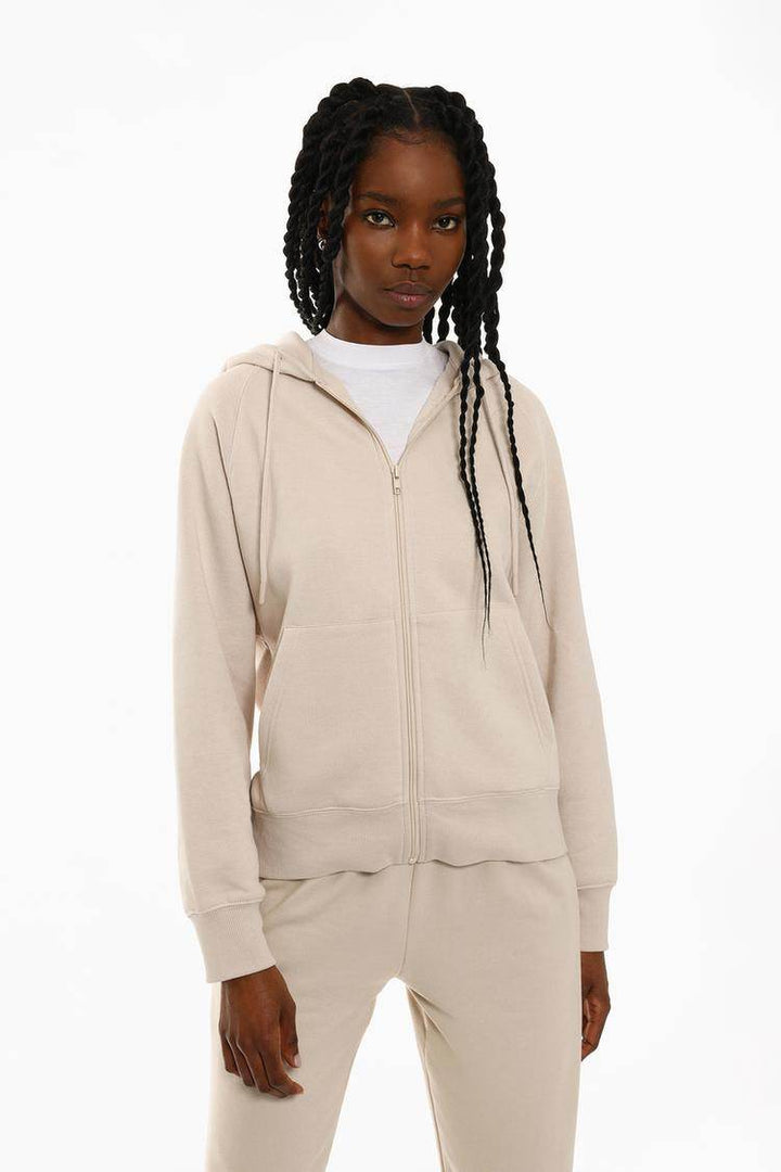 Front view of women's beige hooded jacket

