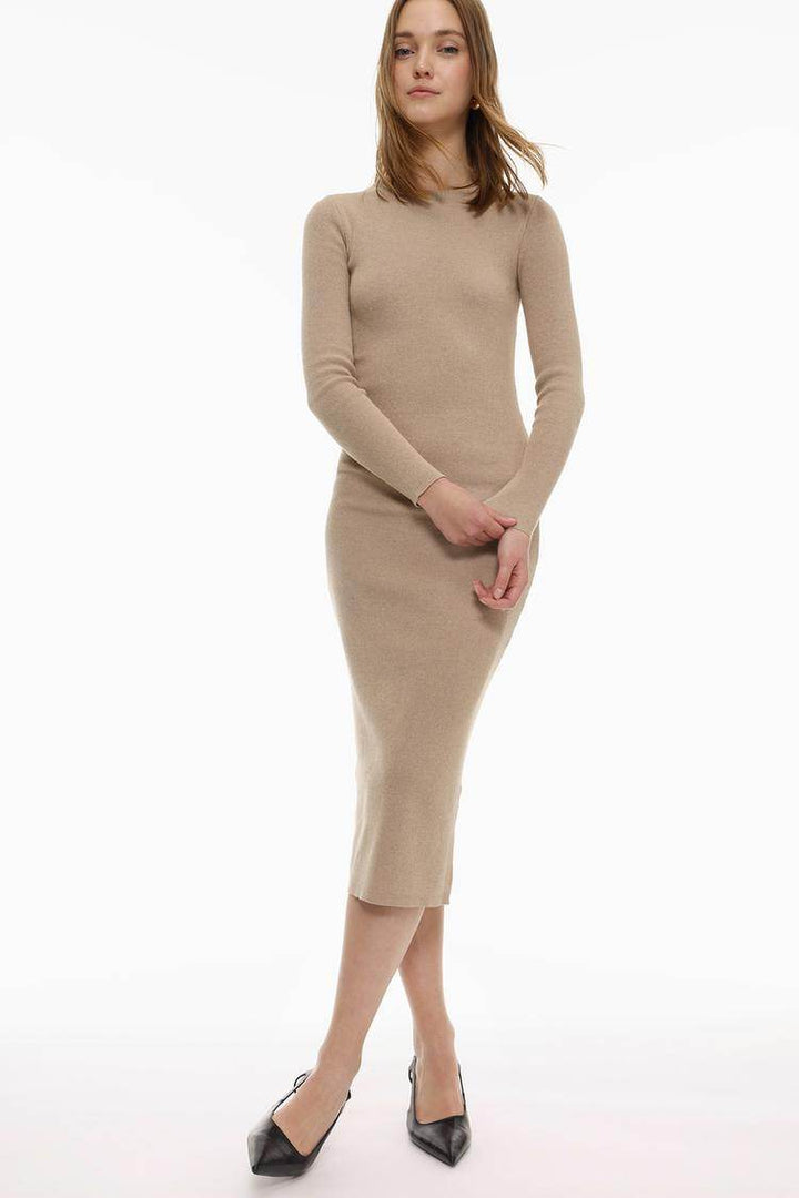 Model showing the beige knit midi dress front view

