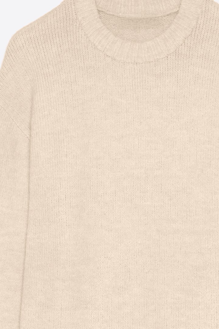 Close-up product image of beige soft sweater


