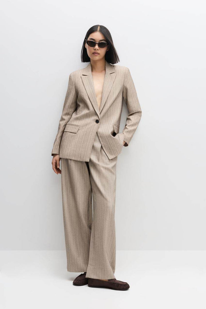 Front view of a beige women's pinstripe blazer
