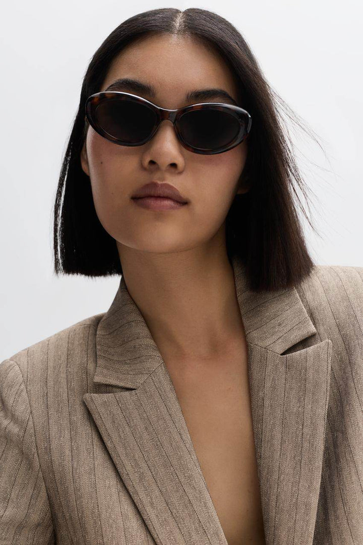 Zoomed view of a beige women's pinstripe blazer
