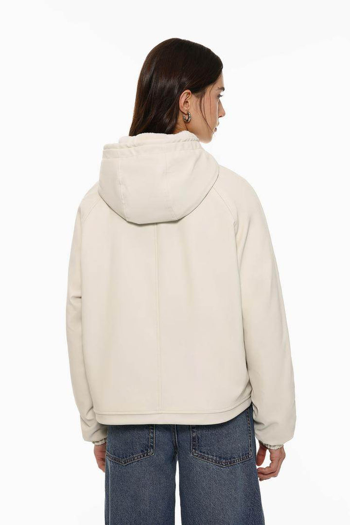 Back view of the women's beige rubberised parka

