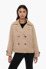 Front view of women's beige short oversize trench coat

