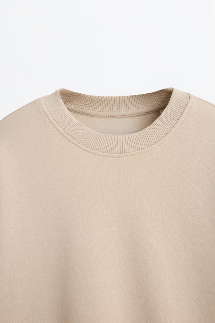 Zoomed view of a beige women's sweatshirt
