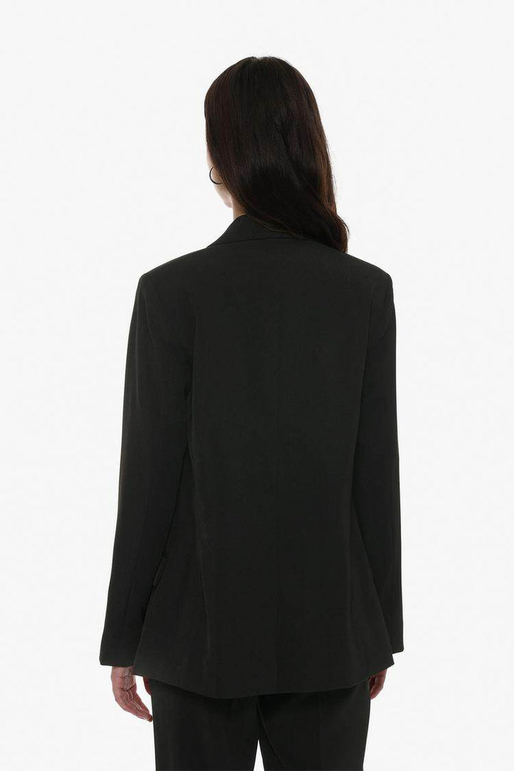 Back view of the women's black basic blazer


