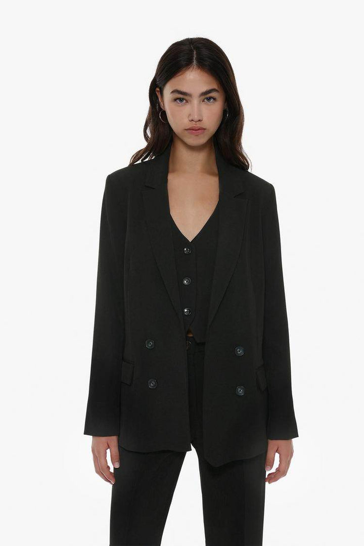 Front view of women's black basic blazer

