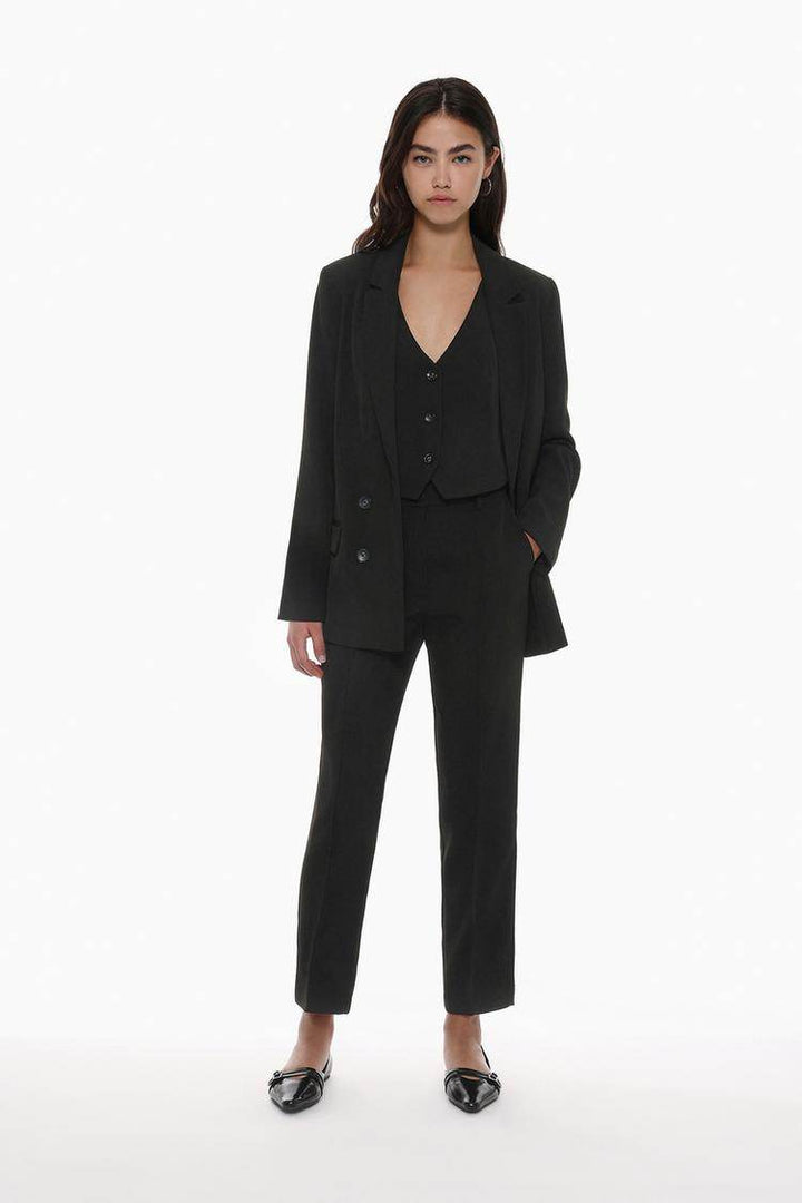Full body front view of woman wearing black basic blazer


