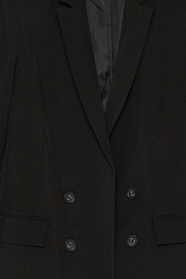 Close-up product image of black blazer material


